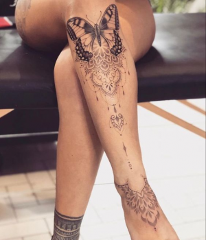 Butterfly mandala tattoo on the leg