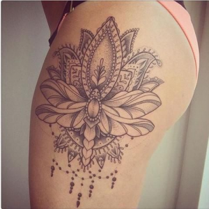 Lotus tattoo on the thigh