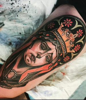 Neo-traditional Catholic Mary tattoo on the leg