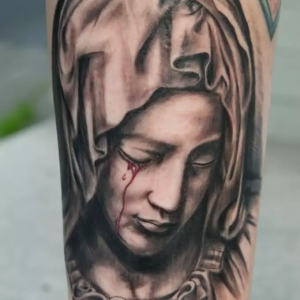 Catholic Mary Statue Tattoo with tears