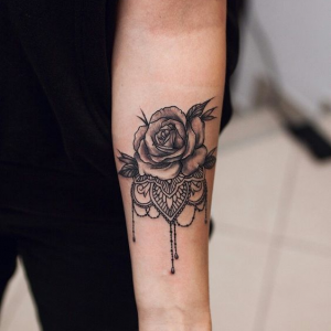 Rose tattoo on the forearm