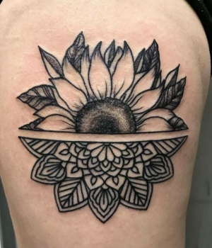 Sunflower mandala tattoo on the thigh