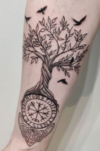 Yggdrasill design with runes on the roots of a tree and the birds on the branches