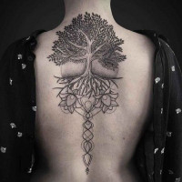 Fine line Yggdrasil with flower elements inked on the spine