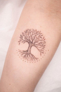 Small Yggdrasil tree inked on the forearm
