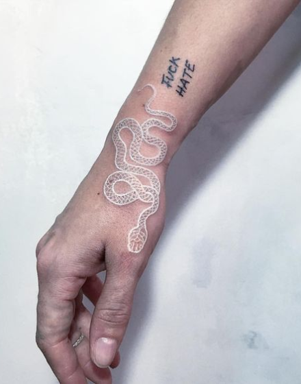 The snake is a very bold symbol, but in white it looks less rude The snake is a very bold symbol, but in white it looks less rude