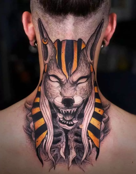 The back tattoo of an Anubis with orange lines