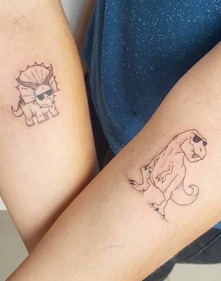 Couple Tattoos with Dinosaur Motifs