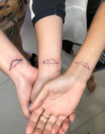 Couple Tattoos with Dinosaur Motifs