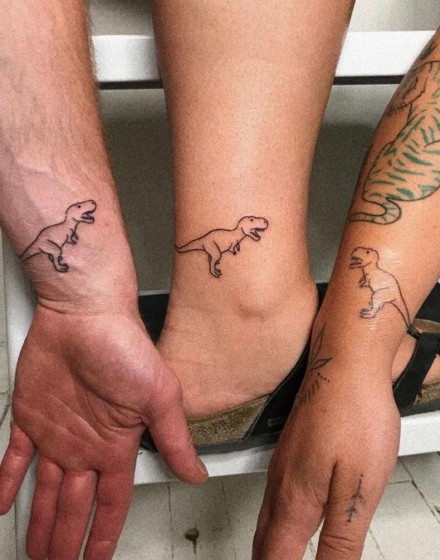 Couple Tattoos with Dinosaur Motifs