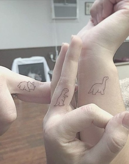 Couple Tattoos with Dinosaur Motifs