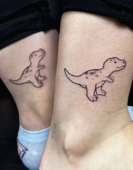 Couple Tattoos with Dinosaur Motifs