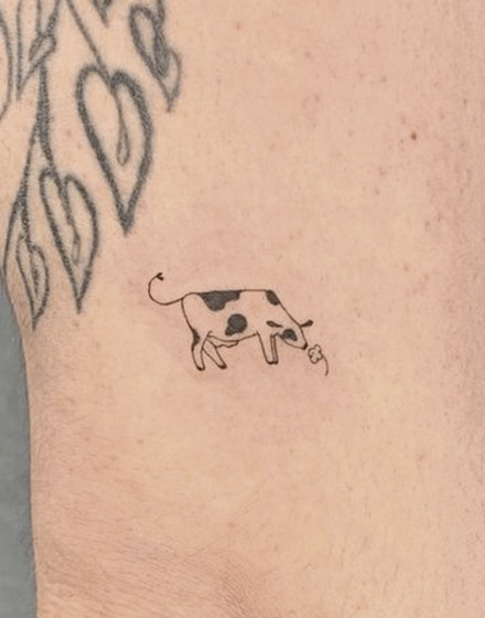 Minimalistic Cow Tattoo
