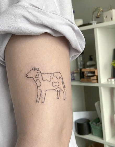 Minimalistic Cow Tattoo