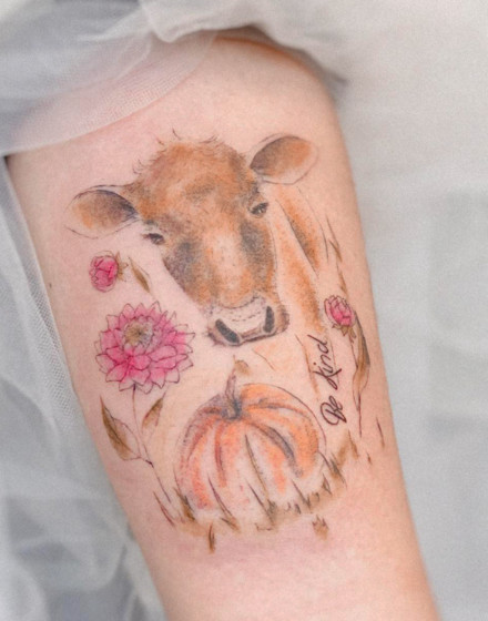 A Cow Tattoo With Flowers