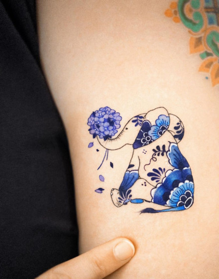 Elephant Tattoo With Flowers
