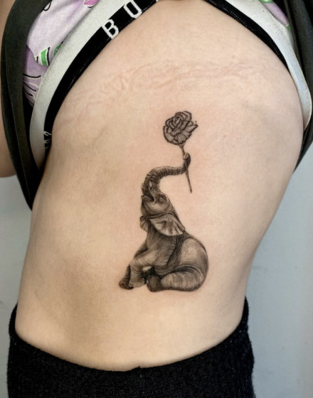 Elephant Tattoo With Flowers