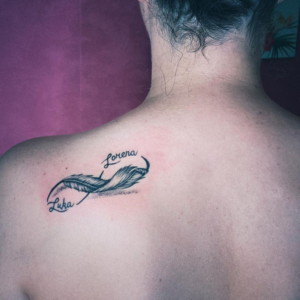 Infinity and Feather inked on the back