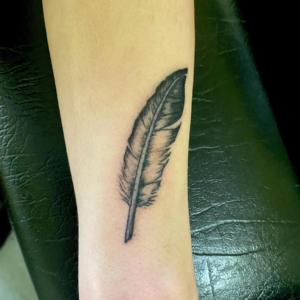 Eagle's feather inked on the arm