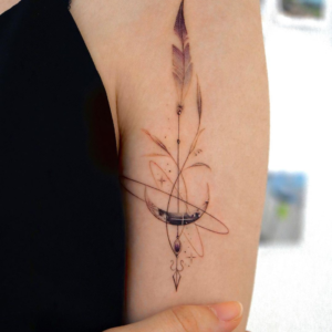 Feather and arrow tattoo on the bicep