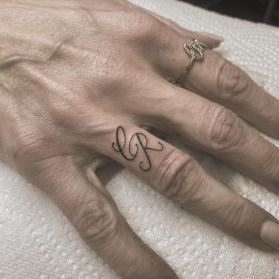 Fingers tattoo by Joe