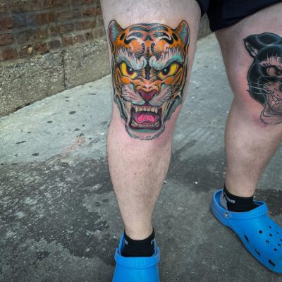 Knee tattoo by Sean Adams