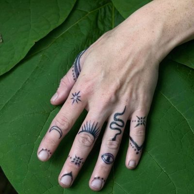 Fingers tattoo by Kacie