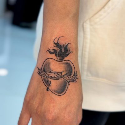 Wrist tattoo by Keith Tran