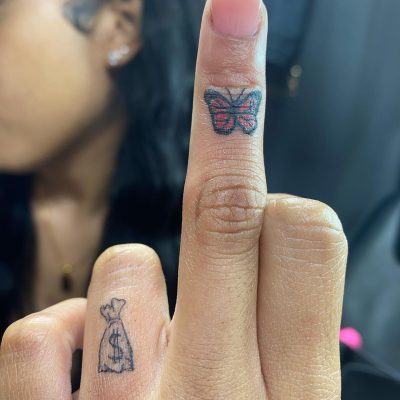 Fingers tattoo by Paul Jordan