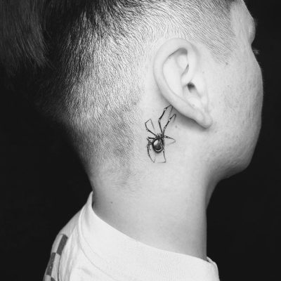 Ear tattoo by Esteban Salazar