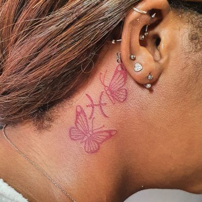 Ear tattoo by Julio Roslindo