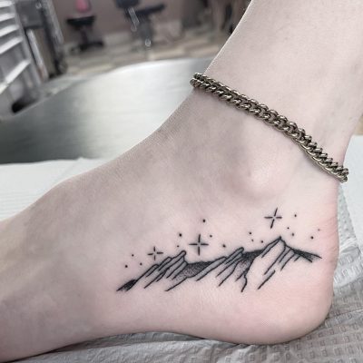 Foot tattoo by Spencer Reisbeck
