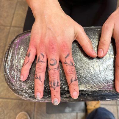 Fingers tattoo by Ray Schmoldt