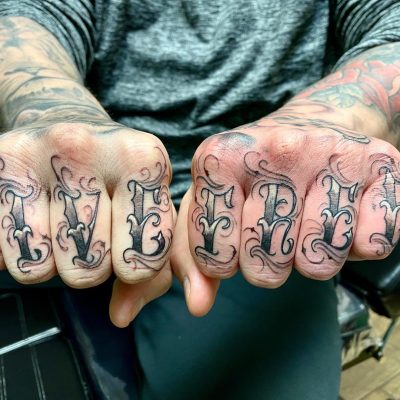 Fingers tattoo by Zak Ratzlaff