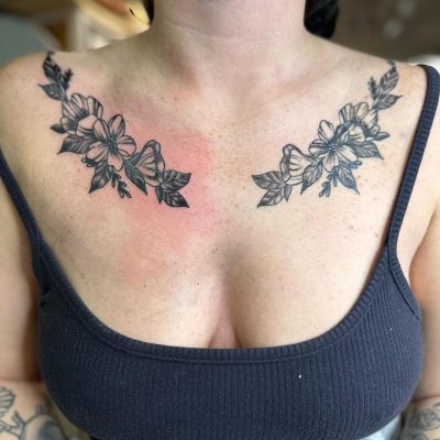 Collar bone tattoo by Tony