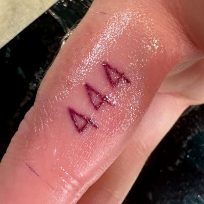 Fingers tattoo by Eric Morris