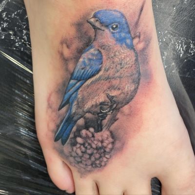 Foot tattoo by Mando Hernandez