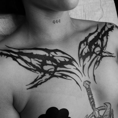 Collar bone tattoo by Francis Logan